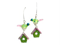 Playful and whimsical Earrings, consistant of a little glass bird and a bird house in spring colors