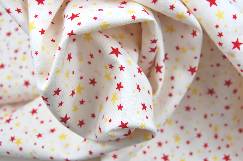 Helle Baumwolle mit gelb-roten Sternen 05 Meter 2