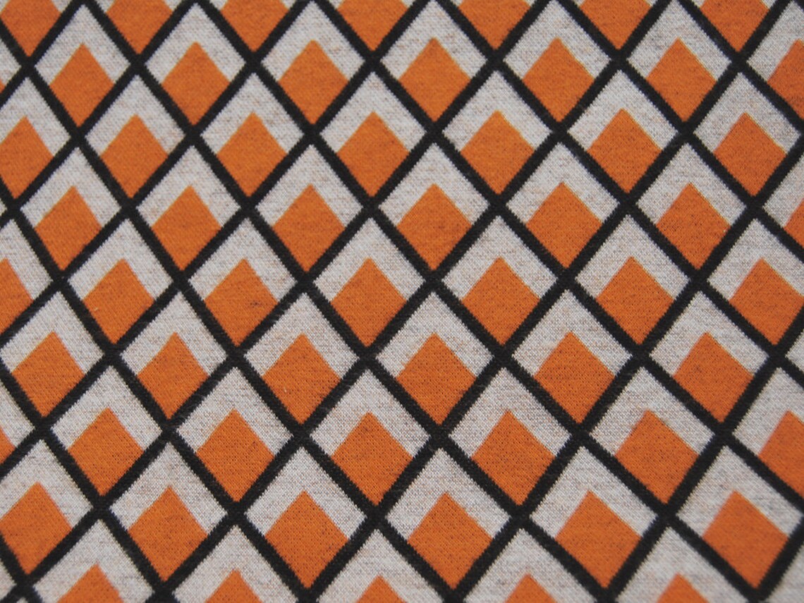 Bio - Baumwoll Jacquard-Jersey - Graphisches Muster in Orange-Creme-Schwarz 0,5m