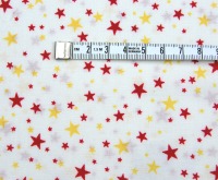 Helle Baumwolle mit gelb-roten Sternen 0.5 Meter 4