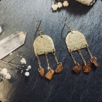 Hand-stamped earrings with baltic amber