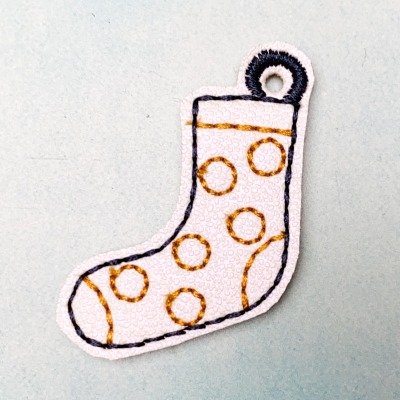 Schlüsselanhänger weiße Socke mit senfgelben Punkten -Welt Down Syndrom Tag