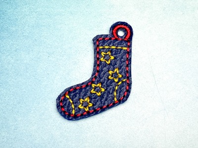 Schlüsselanhänger dunkelblaue Socke mit gelben Sternen -Welt Down Syndrom Tag