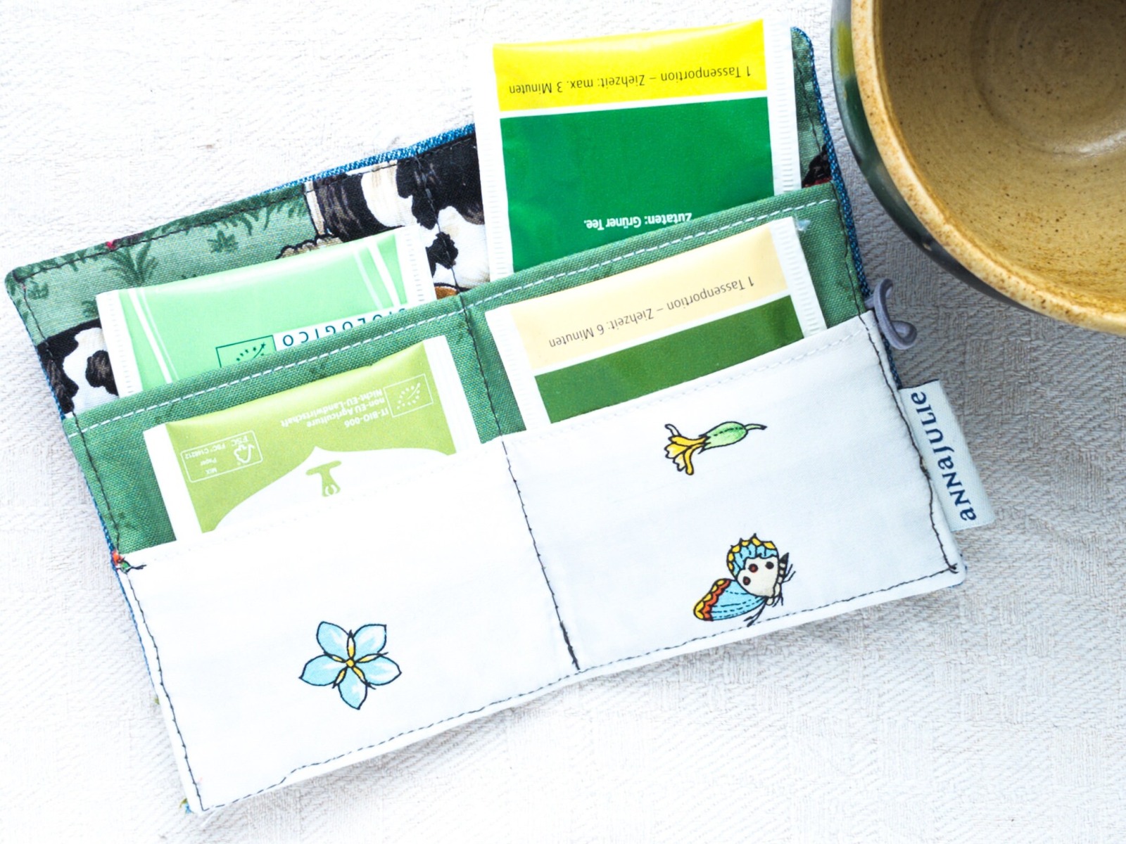 Teebeuteletui | olivgrün und grau | Heft für Teebeutel | verspielt | Blumen und Zweige |