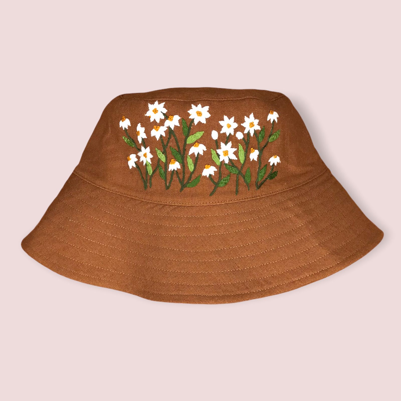 https://files.azoo.co/generate/634/1600/d9bed867-390c-4962-8945-80649d4aa8cb/1-reversable-bucket-hat-with-hand-embroidered-daisy-bush.png