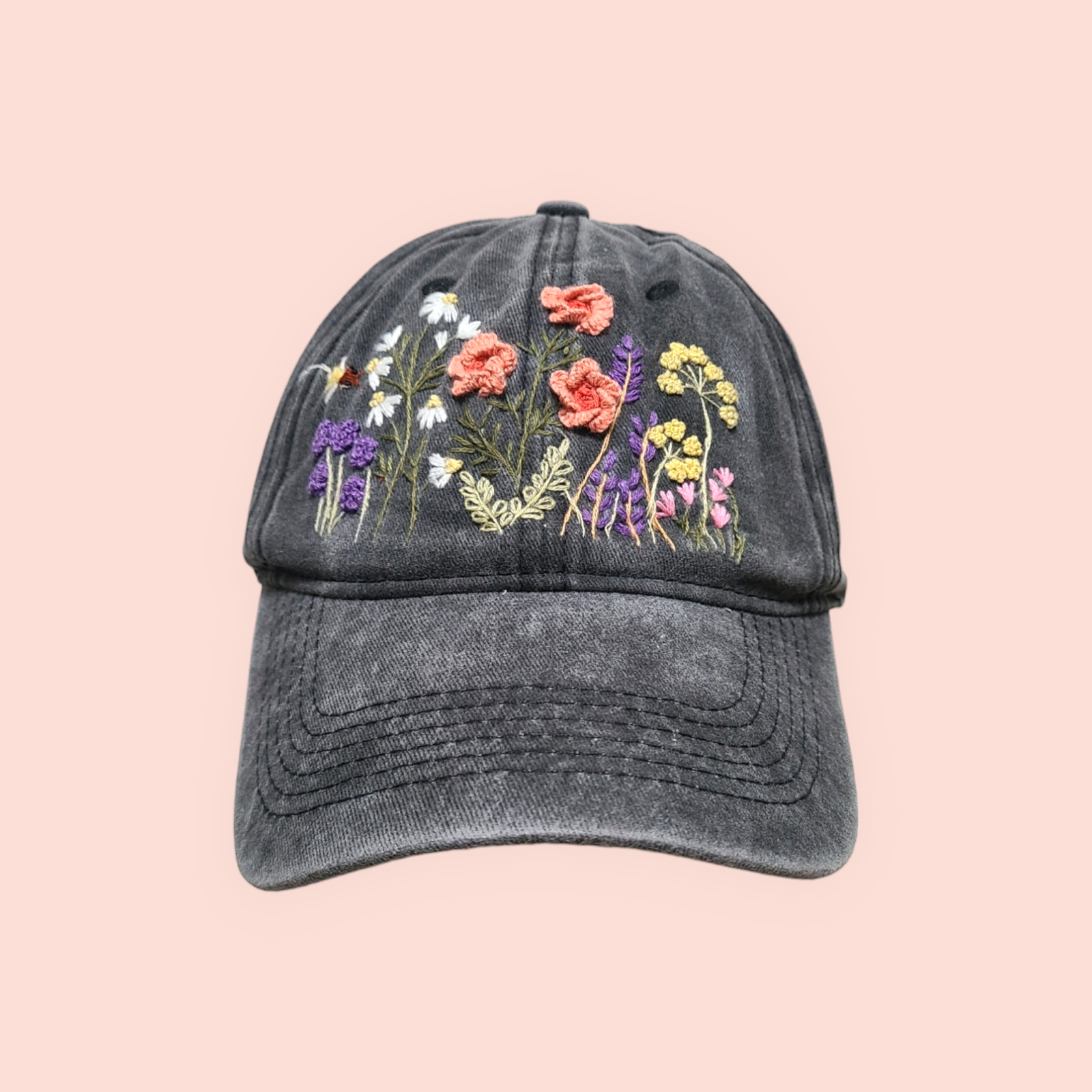 Baseball cap with hand-embroidered wildflower