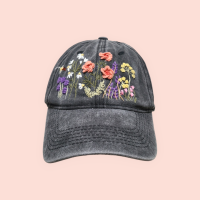 Baseball cap with hand-embroidered wildflower