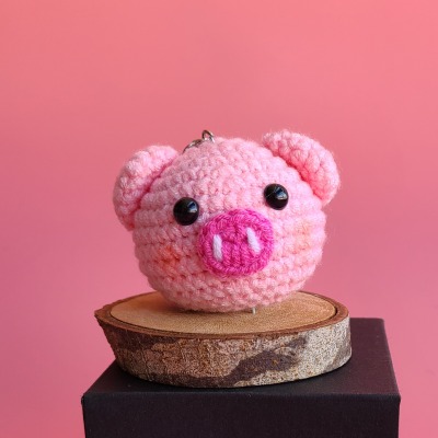 Crocheted pigs head keychain