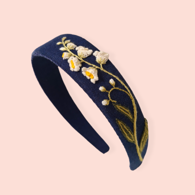 Floral headband with embroirered lily of the valley