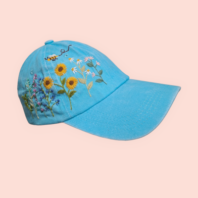 Baseball cap with hand-embroidered sunflower