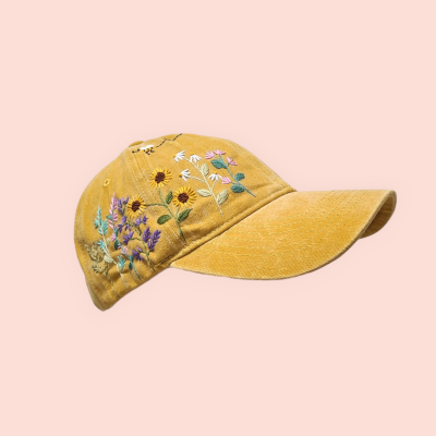 Baseball cap with hand-embroidered wildflower