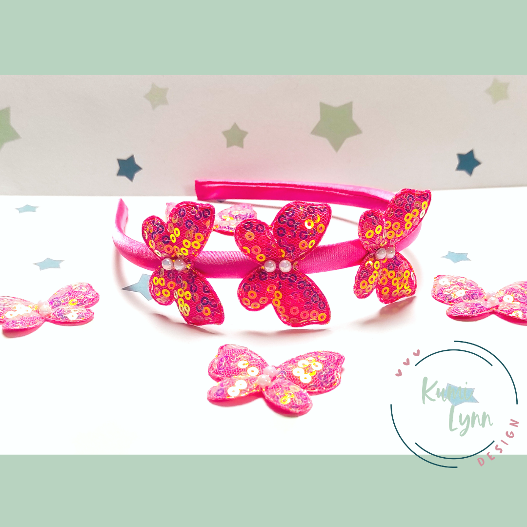 Haarreif mit Schmetterlingen besetzt mit Pailletten -pink-